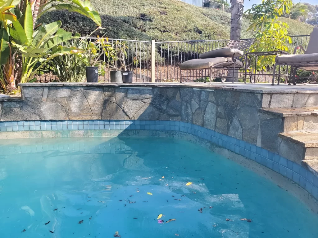 San Diego Pool Tile Cleaning removing hard water buildup from pool borders in San Diego, California