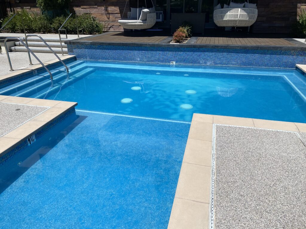 San Diego Pool Tile Cleaning removing calcium buildup from pool tile in San Diego, California