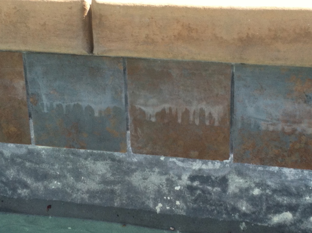 Visible chemical etching on the tile glaze